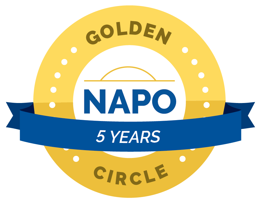 Circular golden anniversary emblem celebrating five years with a blue ribbon banner.